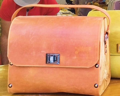 Orange oil leather top handle bag and olive treee wood
