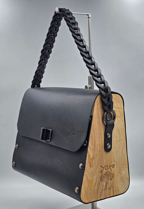 Black vachetta leather top handle bag with olive treee wood Leather braided strap