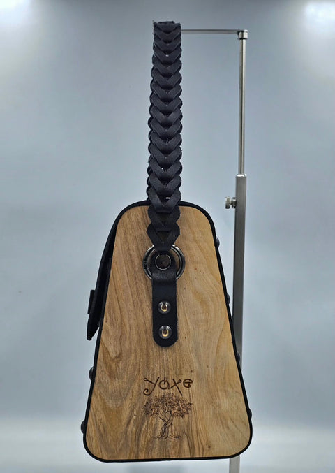 Black vachetta leather top handle bag with olive treee wood