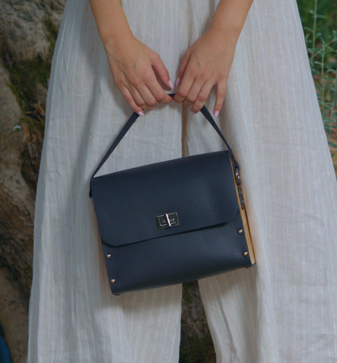 Black vachetta leather top handle bag with olive treee wood Stripe Top and Crossbody leather