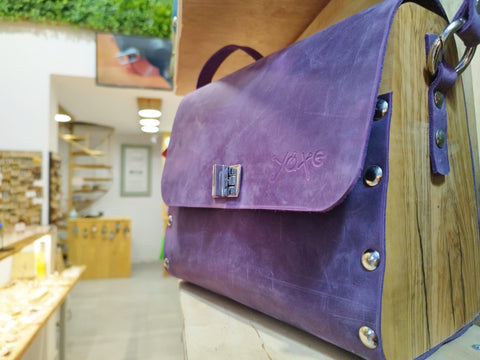 Purple oil leather top handle bag and olive treee wood