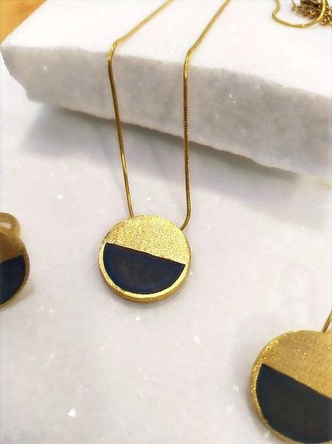 Pendant from gold plated brass and concrete